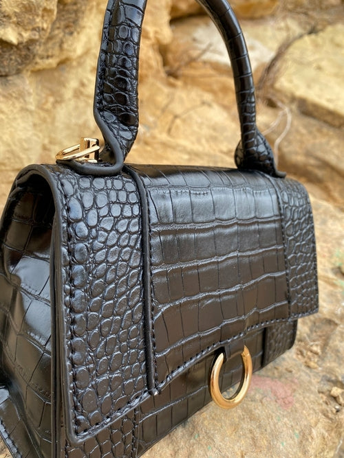 Skuldertaske til damer med præget dyremønster og spænde